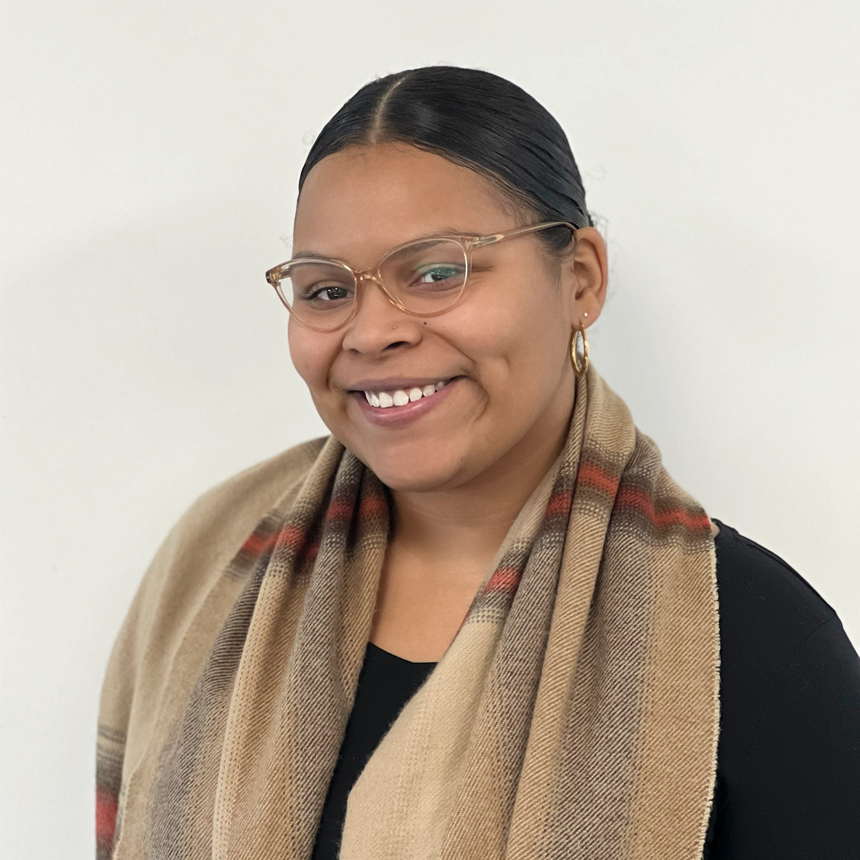 woman wears black long-sleeved dress